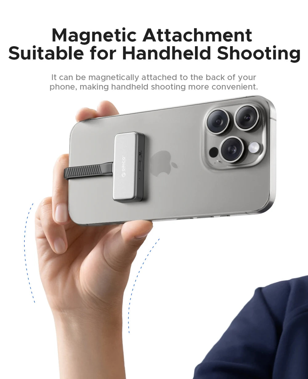 Smartphone with magnetic attachment held by a hand, suitable for handheld shooting.